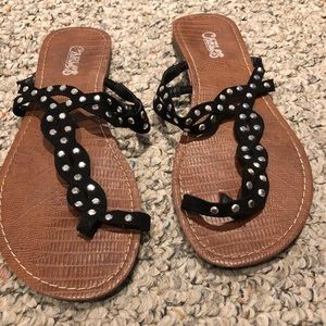 Black sandals with studs.